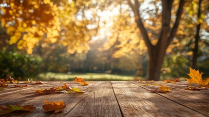 Empty wooden fall table with autumn leaves and soft golden tones, perfect for a product display