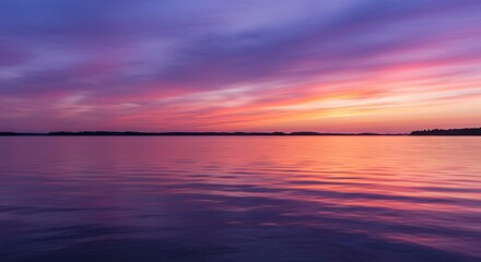 Obraz premium Lake Reflections at Sunset with Vibrant Purple and Orange Sky