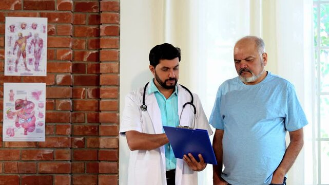 Indian Asian male doctor walks with a senior patient in a hospital passage, explaining the case report and procedure. He provides expert guidance, ensuring clarity, confidence, and quality healthcare