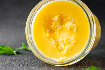 Ghee butter or clarified butter delicious gourmet food background on the table rustic food top view copy space keto and paleo diet vegetarian and vegan food