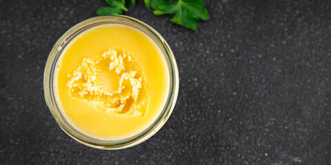 Ghee butter or clarified butter delicious gourmet food background on the table rustic food top view copy space keto and paleo diet vegetarian and vegan food