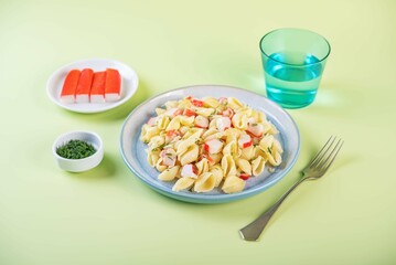 Imitation crab sticks pasta in a plate © nata_vkusidey