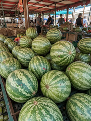 watermelons being sold at the fair