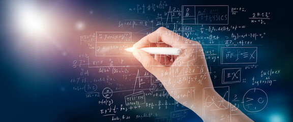 Hand writing mathematical formulas and equations on a dark background, illustrating concepts of science, physics, and complex calculations