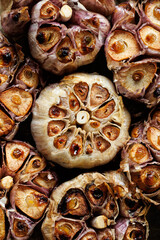 Roasted garlic bulbs, close-up view. Garlic background