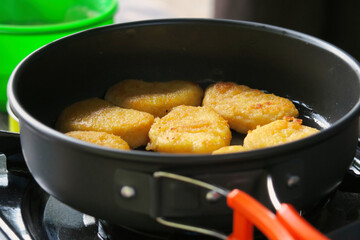 Golden Brown Chicken Nuggets Cooking in Pan