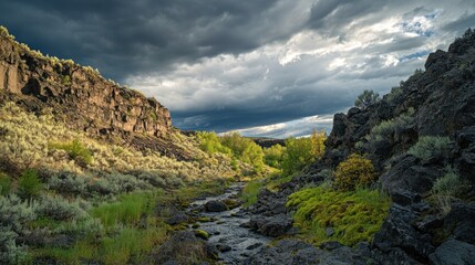 Fototapeta premium Serene Stream in Dramatic Landscape: A Canyon's Peaceful Embrace Under a Stormy Sky