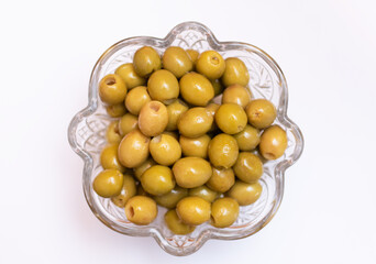 Delicious grilled green olives isolated on white.