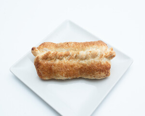 a pie on a white plate on a white background