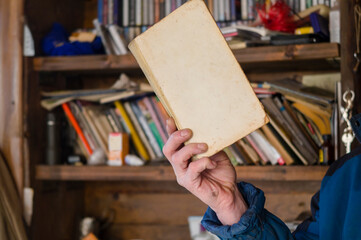 hand holding open book