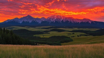 Obraz premium Fiery Sunset over Mountain Range