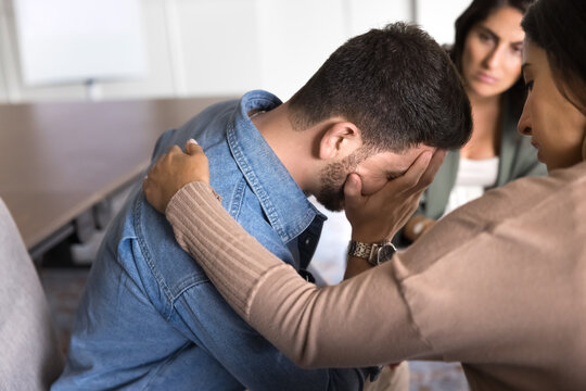 Social community member provide psychological support to participant, touch his shoulder as empathetic gestures, showing care and help, give hope, guidance, and encouragement in hard life situations