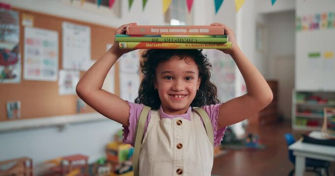 Balance, books and face of girl student in school classroom for development, growth or learning. Future, knowledge and smile with happy kid in academy for elementary study or youth scholarship