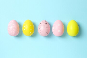 Happy Easter. Colorful eggs on color background, space for text or advertising