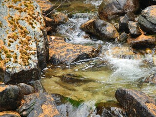 Moving water along rocks in creek