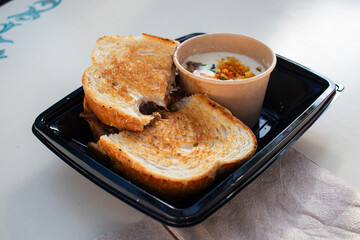 toasted sandwich cut in half with dip