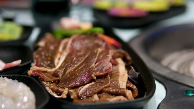 Butcher prepares beef slices, close up