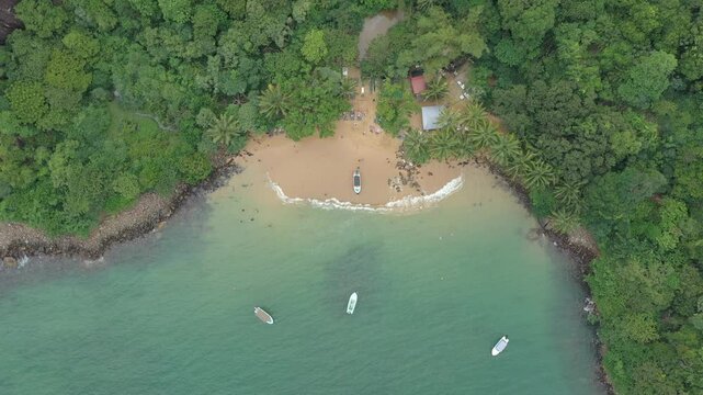 Aerial view of tropical Jungle Beach in Unawatuna Sri Lanka. Panoramic view of exotic coastline and tropical forest. Paradise Beach.