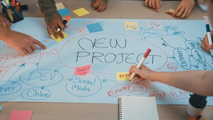 A group of diverse hands collaborating on a new project during a brainstorming session. Colorful...