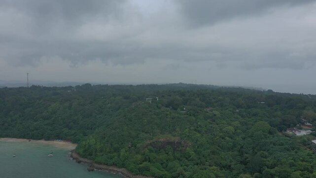 Aerial view of tropical Jungle Beach in Unawatuna Sri Lanka. Panoramic view of exotic coastline and tropical forest. Paradise Beach.