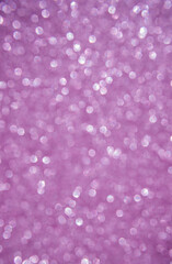 A soft pink bokeh-style background with unfocused light creates an elegant space for text or design elements.