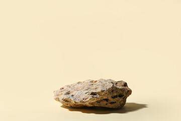 Decorative stone podium on beige background