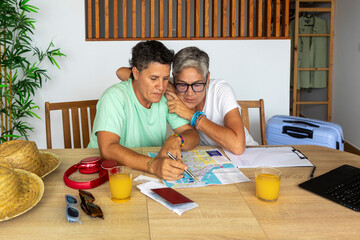 Lesbian couple plans summer vacation in cozy home setting