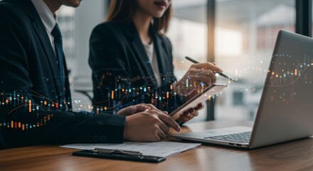 Businesspeople Analyzing Financial Data on Tablet and Laptop Stock Market Graph Overlay
