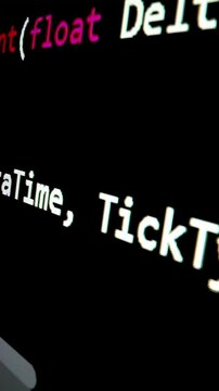 Closeup macro shot movement of coding script moving across LED screen with real-time AI-generated typing, showcasing advanced AI learning in optimization, debug and coding for software development.
