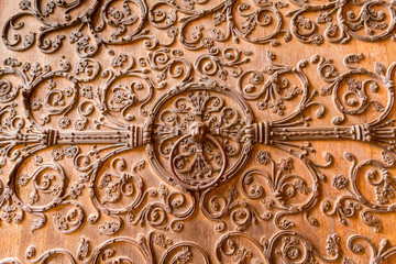 Europe, Paris. Ornate relief carving on a door.