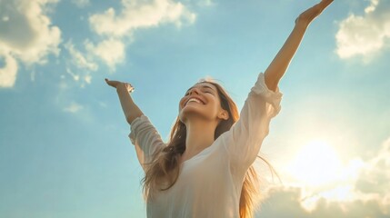 Happy woman raising arms to the sky feeling freedom and happiness
