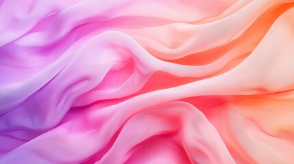 Obraz premium A vibrant, flowing fabric showcasing soft gradients of pink, purple, and orange, creating an ethereal and dreamy aesthetic.