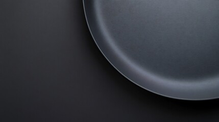 Solid charcoal gray fabric background subtle gradients of light and shadow offering a smooth refined surface