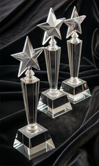 Close-up of a group of star-shaped crystal trophies, symbolizing excellence.