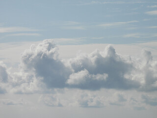 Fototapeta premium Clouds forming within a blue sky. Cloudscape over Galloway, New Jersey.