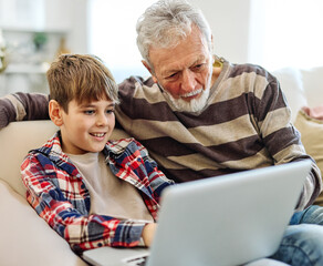 child laptop home family computer together grandfather grandson online senior happy education grandparent school class teacher tutor using kid elderly