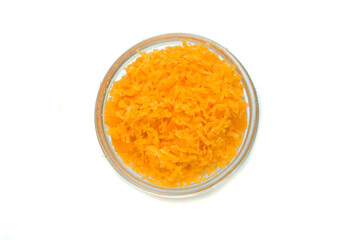 bowl with grated cheddar cheese on white background