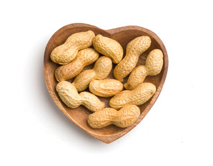 heart shaped bowl with peanuts in shells