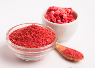 bowls with powder and dry pieces of strawberries