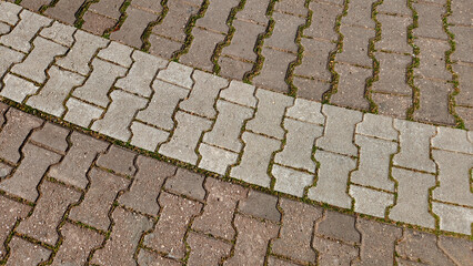 Interlocking pavement blocks in a street