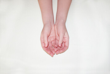 Beautiful refined female hands close-up. Hand care concept, anti-aging cream, spa.