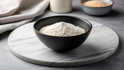 Black Bowl of Flour on Marble Surface for Baking Preparation