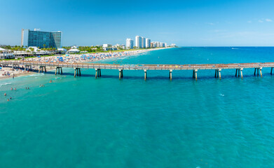 drone view of Deerfield Beach, Florida with city and pier over ocean