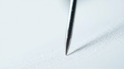 Extreme Macro Photography of Needle Tip on White Fabric - Generative AI