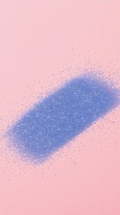 A collection of blue glitter scattered on a pink surface
