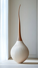 Tall wooden sculpture, minimalist room