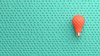 Among a group of white lightbulbs on a teal background, an orange one shines brightly, representing creativity and a standout solution