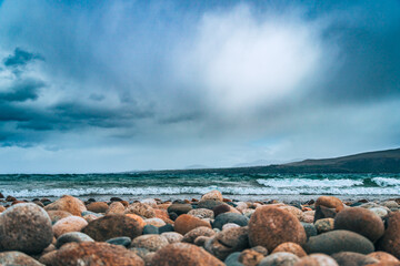 cold lake in patagonia with rocks and sky