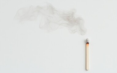 Burnt Matchstick and Smoke on White Background