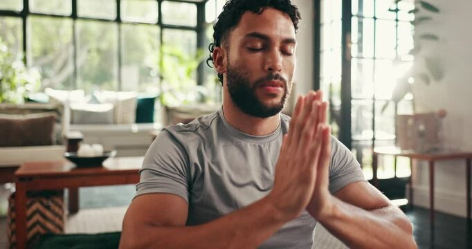 Home, man and meditation with prayer hands for fitness, mindfulness and inner peace with zen in apartment. House, male person and yogi with namaste for holistic wellness, breathing or yoga in morning